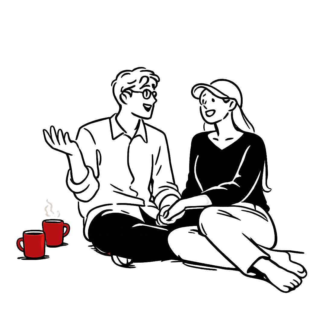 A couple sitting together on a couch, looking at a phone screen between them